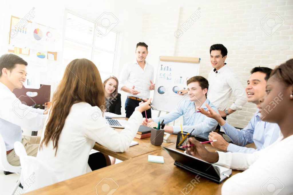 79947362 Young Interracial Business People Discussing Work At The Meeting In Casual Creative Office Teamwork 