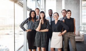 Shot Of A Group Of Well Dressed Businesspeople Standing Together