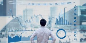 Finance Trader skills Manager Analysing Stock Market Indicators For Best Investment Strategy, Financial Data And Charts With Business Buildings In Background