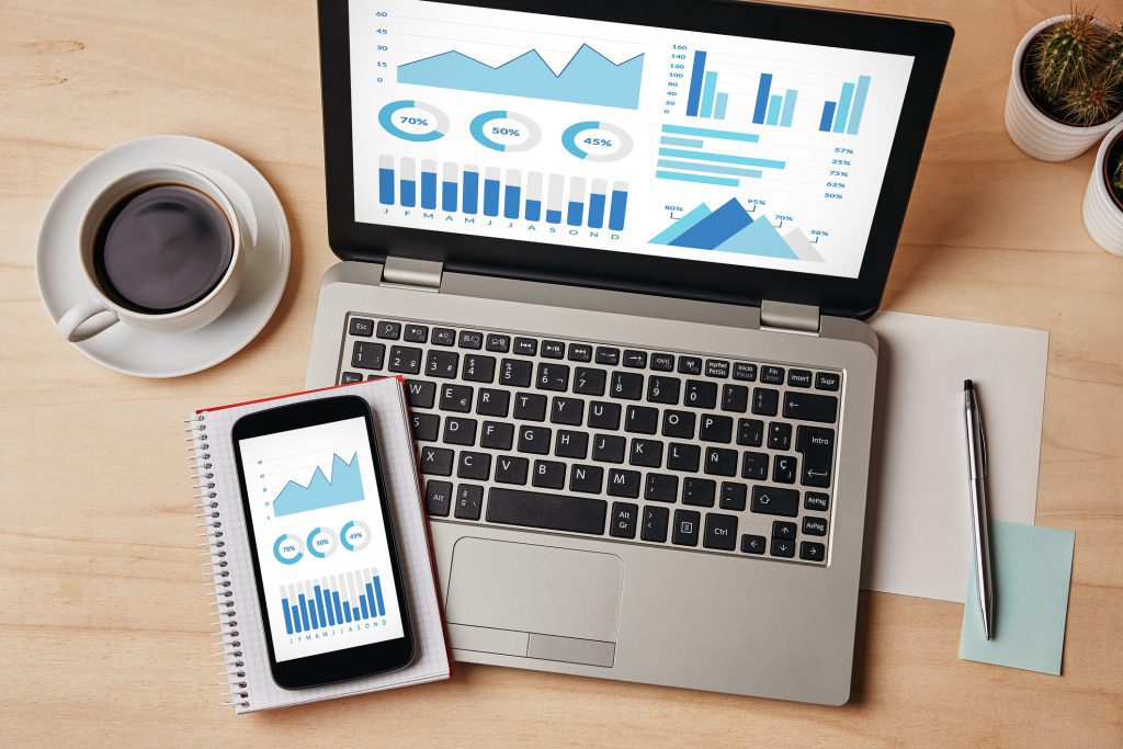 Graphs And Charts Elements On Laptop And Smartphone Screen