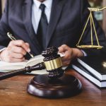 CLAT Lawyer Behind Desk With Gavel 1440x960