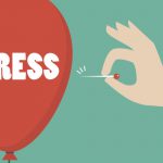 Hand Pushing Needle To Pop The Stress Balloon