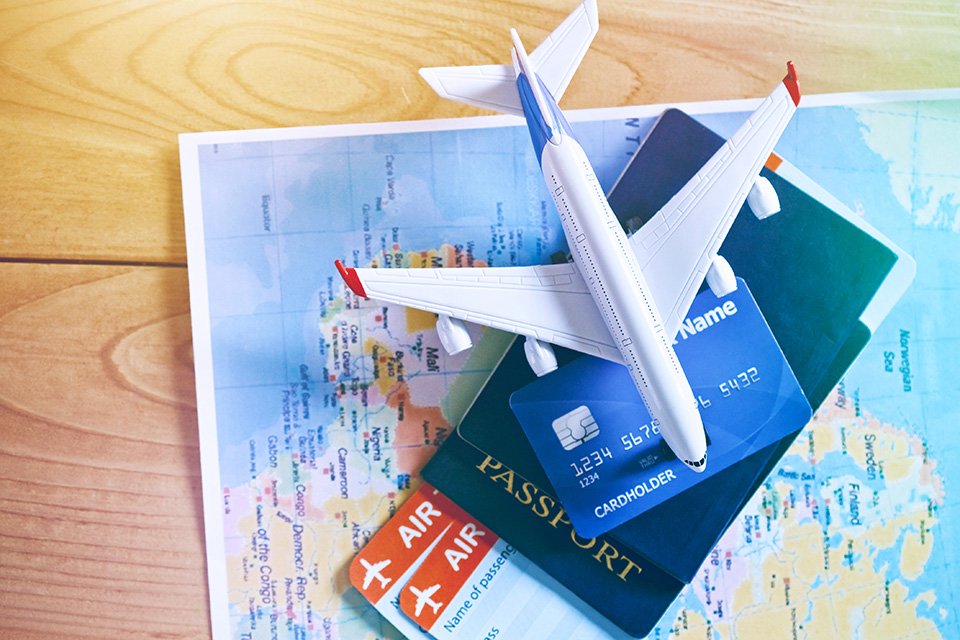aviation industry travel Air Tickets, Passports And Credit Card On World Map. Online Ticket Booking And Holiday Planning Concept