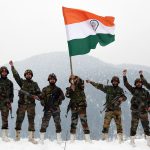 Army Jawans Hold The National Flag And Raise Slogans Near The Snow Covered Border