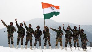 Army Jawans Hold The National Flag And Raise Slogans Near The Snow Covered Border