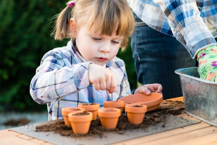 Child Sowing Seeds 696x465