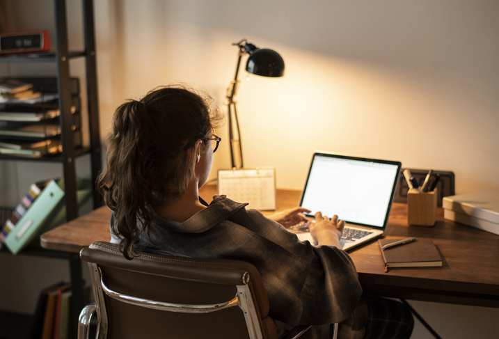 Teen Girl Doing Homework on her laptop