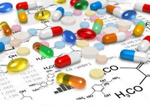 Stock Photo Pharmacy Concept Macro View Of Heap Of Color Pills And Tablets Over Chemical Formulas On White pharmacist