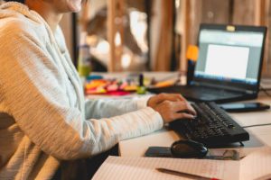 Young Women Working From Home In Her Basement During The Coronavirus Pandemic.