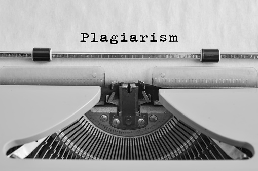 Plagiarism Typed On An Old Typewriter. Vintage Thing. Copyright. Close Up