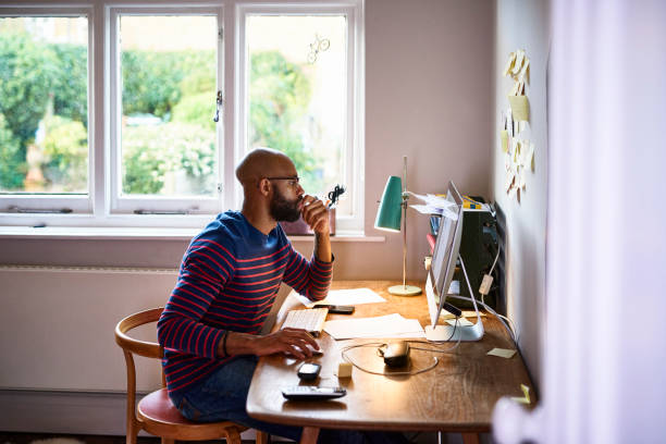 Man Using Computer In Home Office