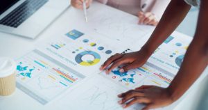 Closeup Shot Two Businesswomen Analysing Graphs In An Office