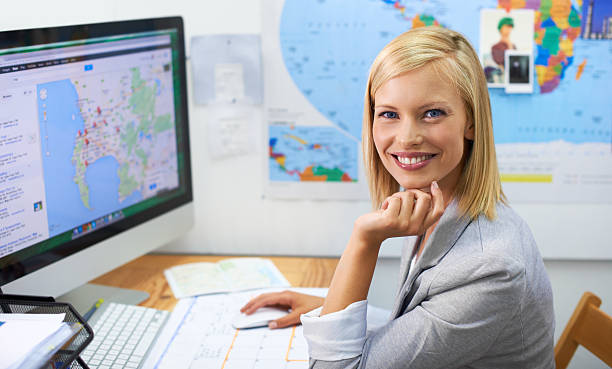 A Beautiful Young Woman Planning An Overseas Trip On The Internet