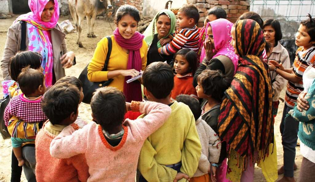 A Social Worker Meeting With A Group Of Villagers