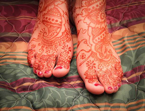 Feet Of An Indian Bride, Covered With Henna. Shallow Dof.
