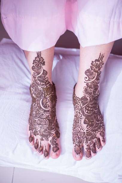 Bride Showing Her Henna Legs And Hands