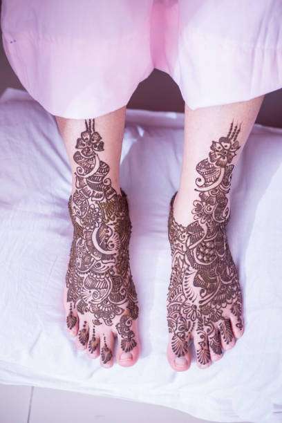 Bride Showing Her Henna Legs And Hands